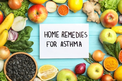 Photo of Natural products and note with text HOME REMEDIES FOR ASTHMA on wooden background, flat lay