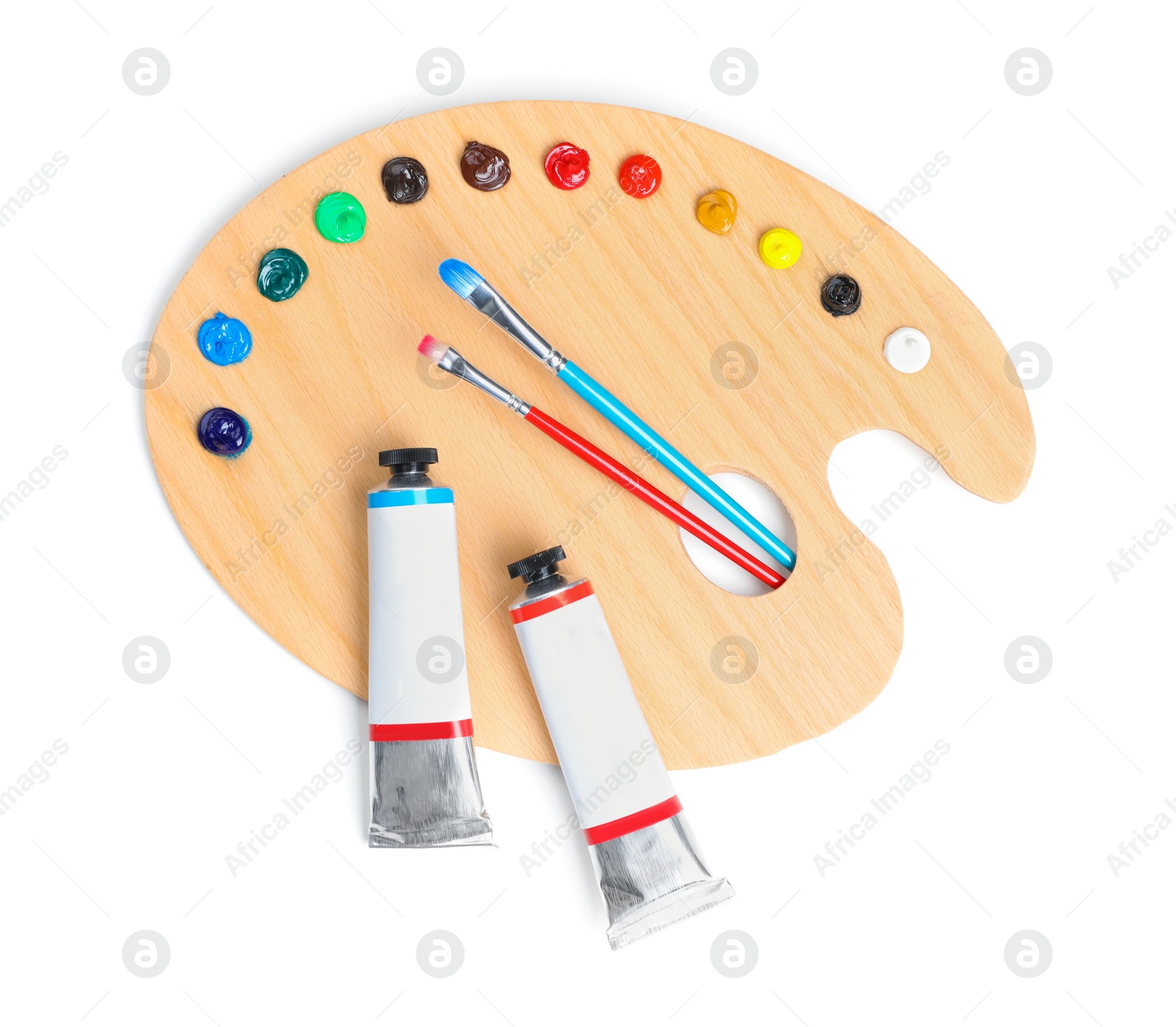 Photo of Palette with acrylic paints and brushes on white background, top view. Artist equipment