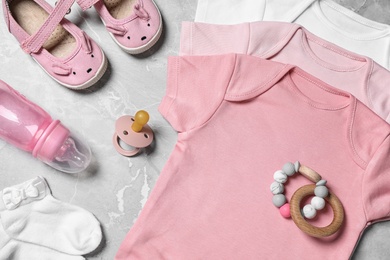 Flat lay composition with cute baby items on grey background