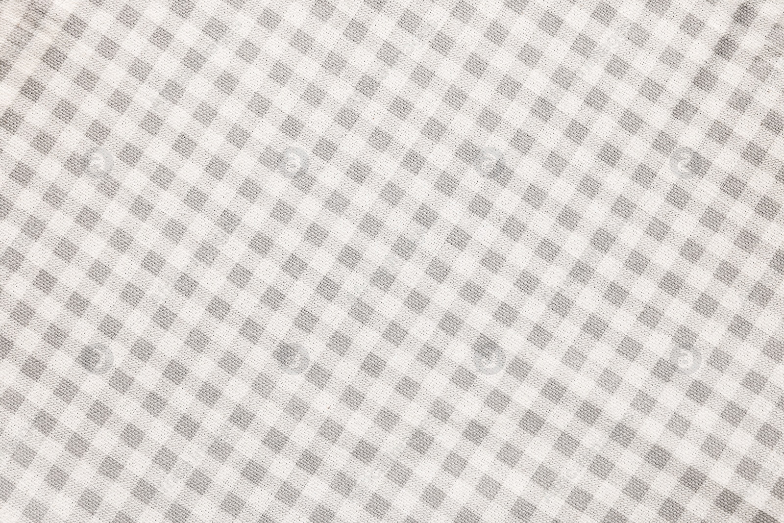 Photo of Beige checkered tablecloth as background, top view