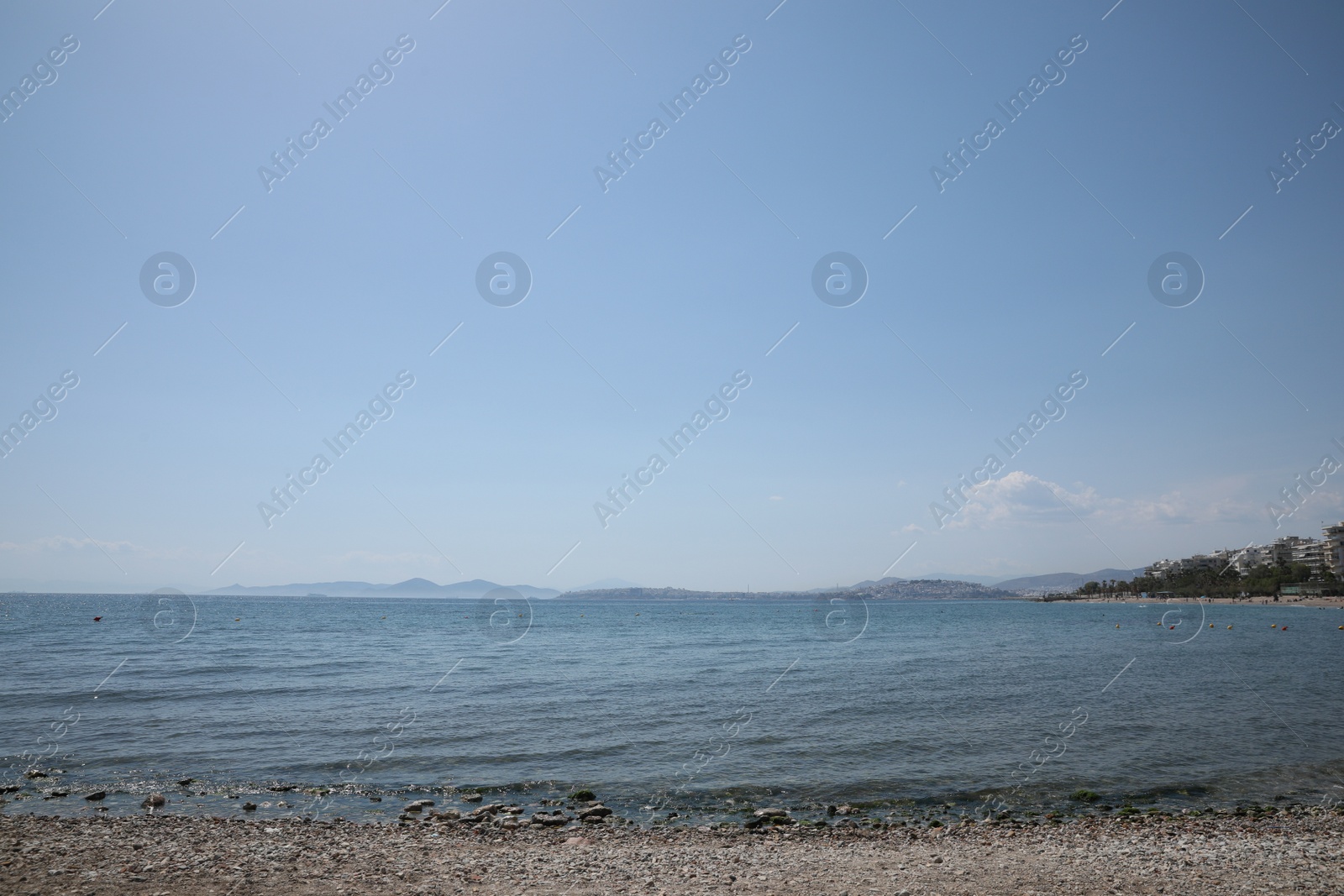 Photo of Picturesque view of beach and calm sea on sunny day