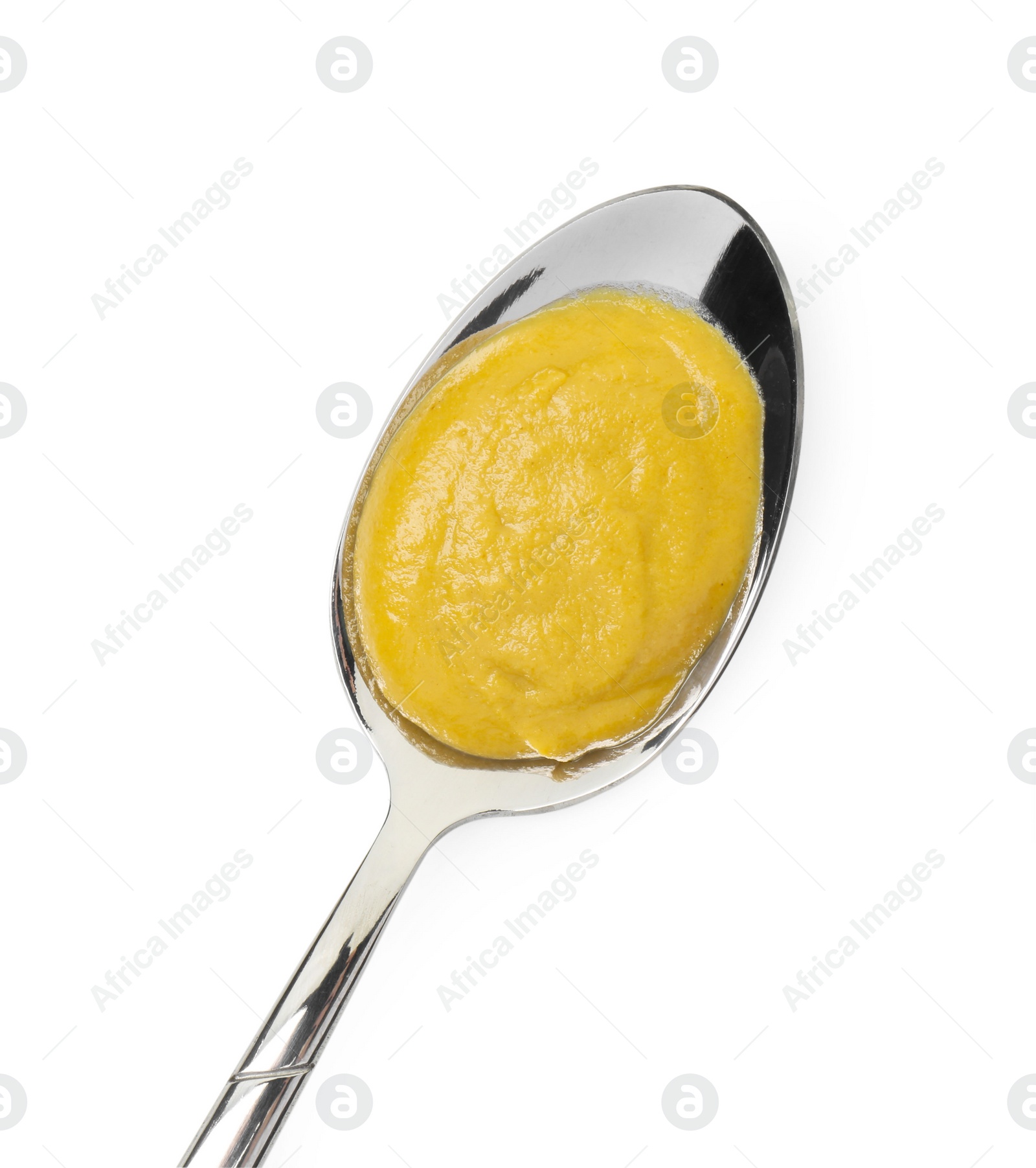 Photo of Tasty mustard sauce in spoon isolated on white, top view