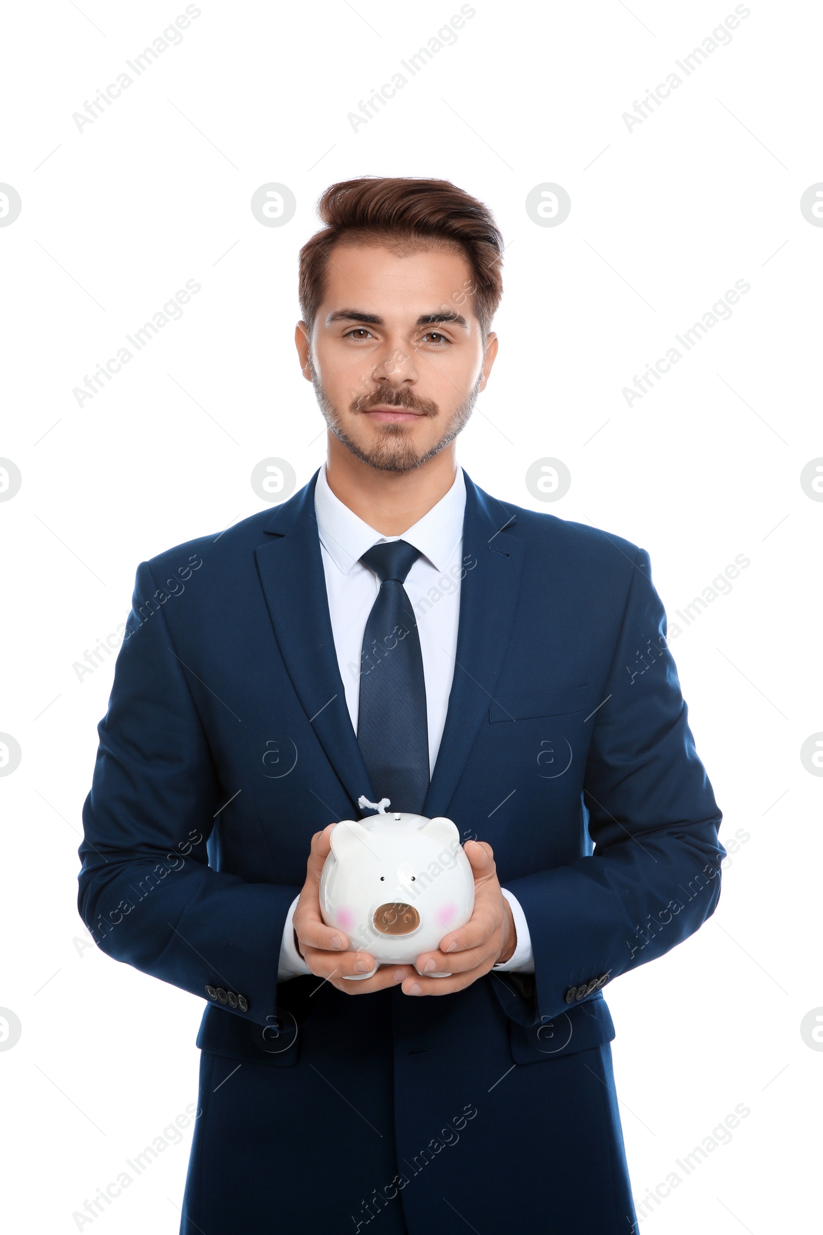 Photo of Young businessman with piggy bank on white background