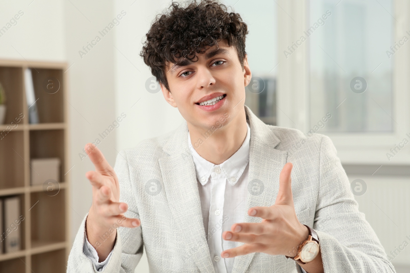 Photo of Young man having online video call at home, view from web camera