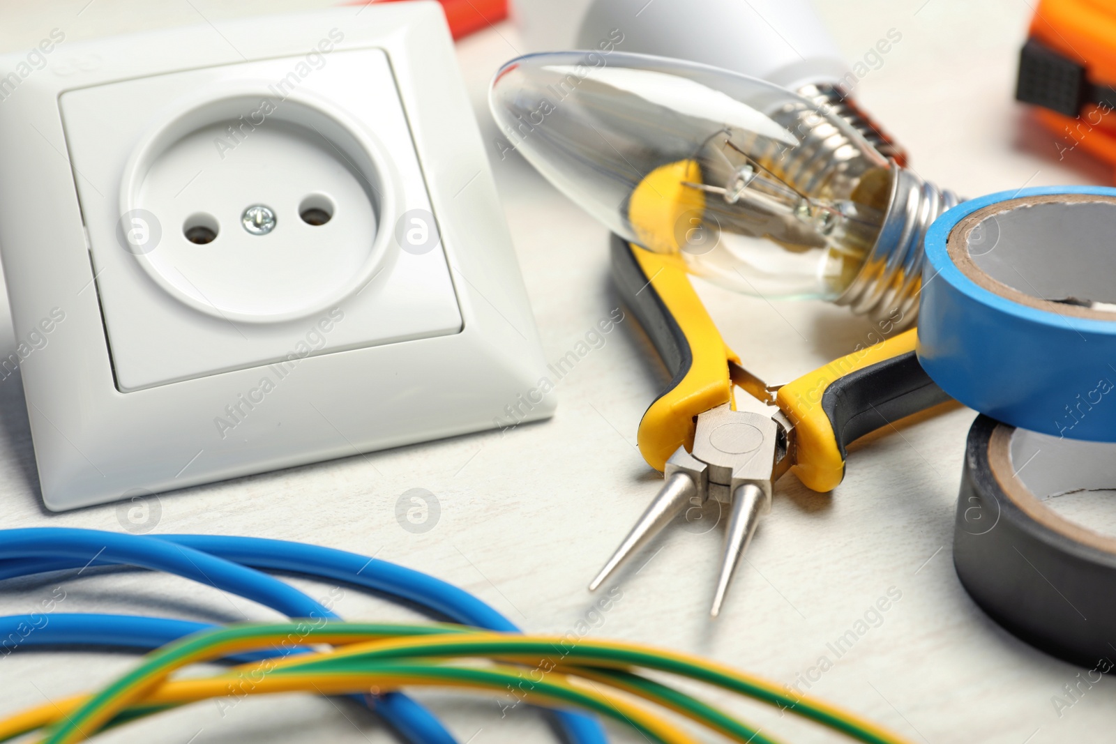 Photo of Set of electrician's tools on light table