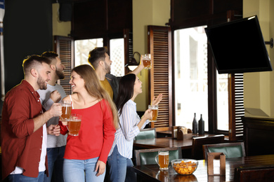 Group of football fans in sport bar