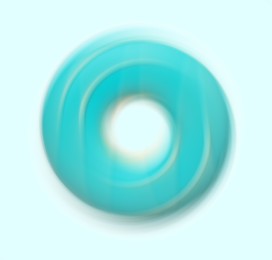 Image of Spinning donut with bright icing on light background, motion effect