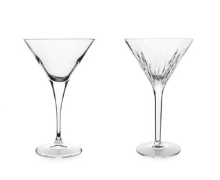 Two beautiful empty martini glasses on white background