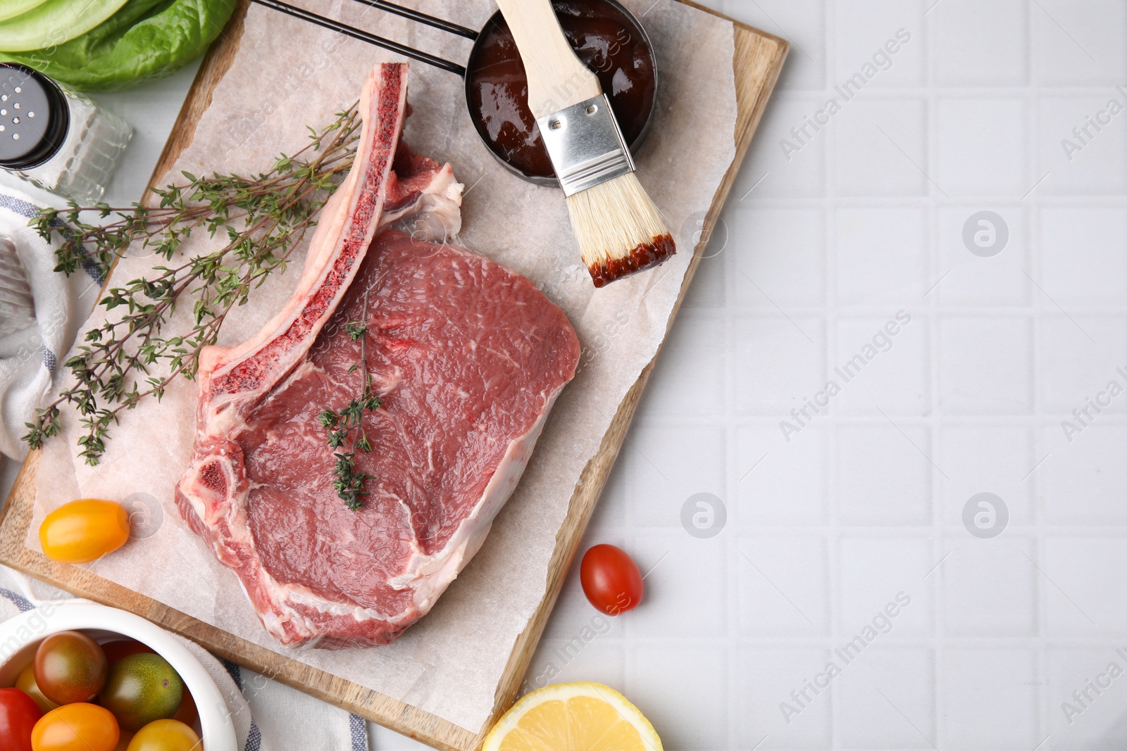 Photo of Flat lay composition with raw meat, thyme and marinade on white tiled table. Space for text