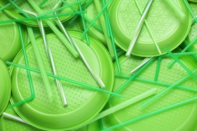 Photo of Different green plastic items as background, closeup