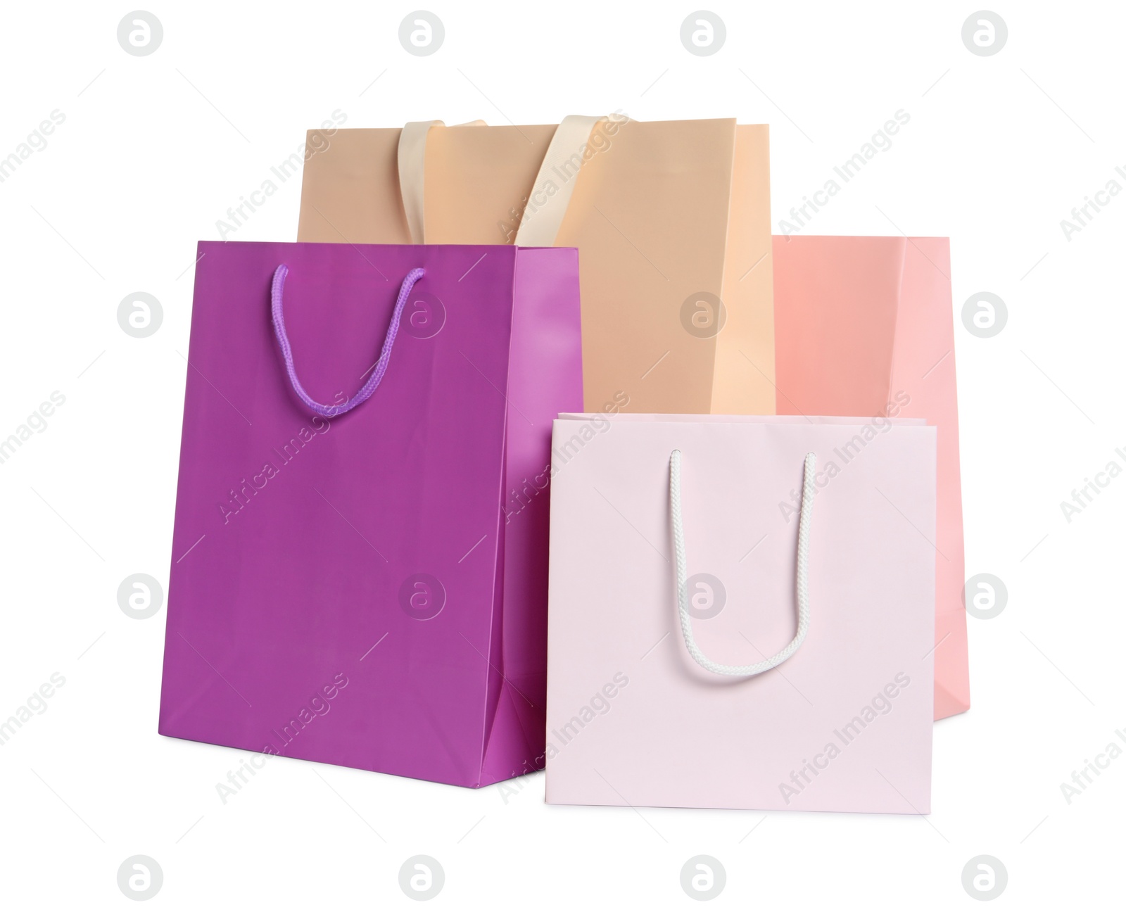 Photo of Colorful paper shopping bags isolated on white