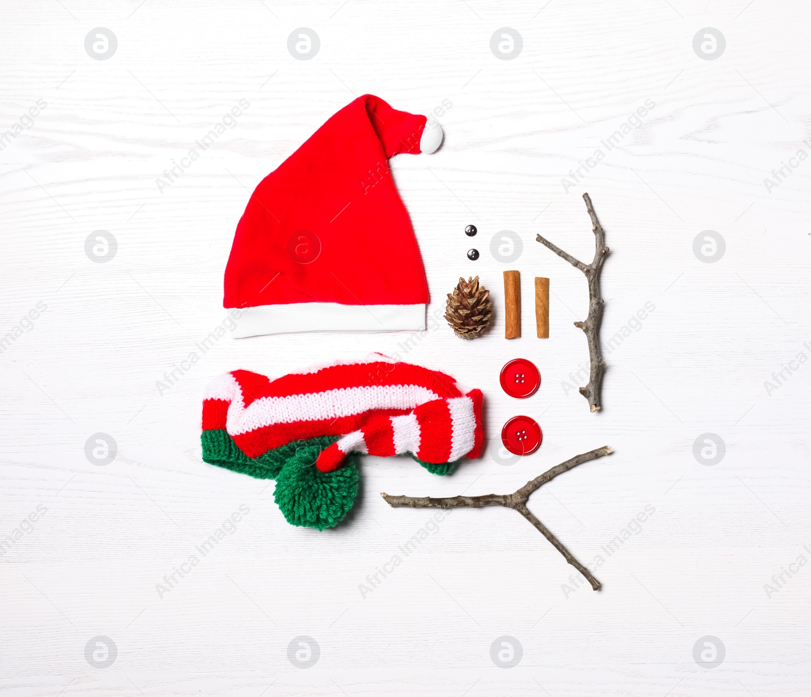 Photo of Set of elements for snowman on white wooden background, flat lay