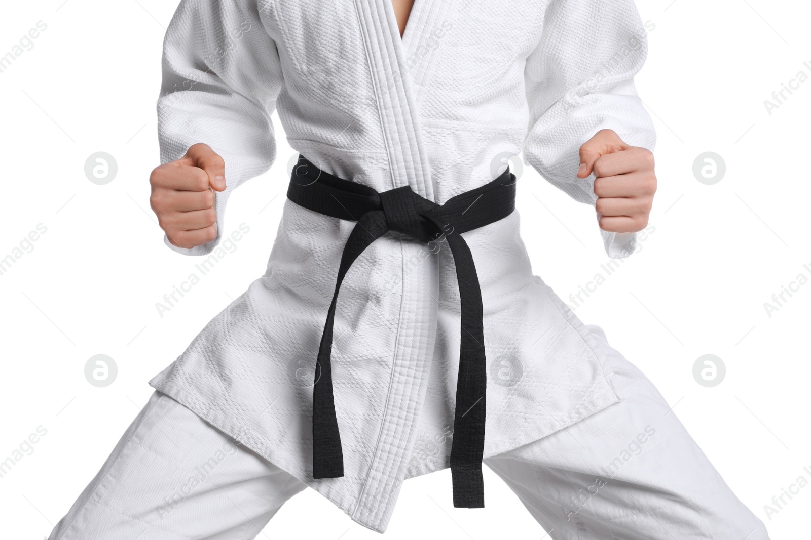 Photo of Martial arts master in keikogi with black belt on white background, closeup