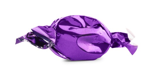 Photo of Candy in purple wrapper isolated on white