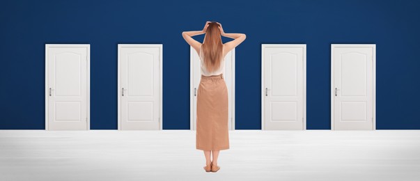 Image of Woman standing in front of many doors, back view. Banner design