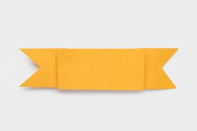 Photo of Paper ribbon on white background, top view. Space for text