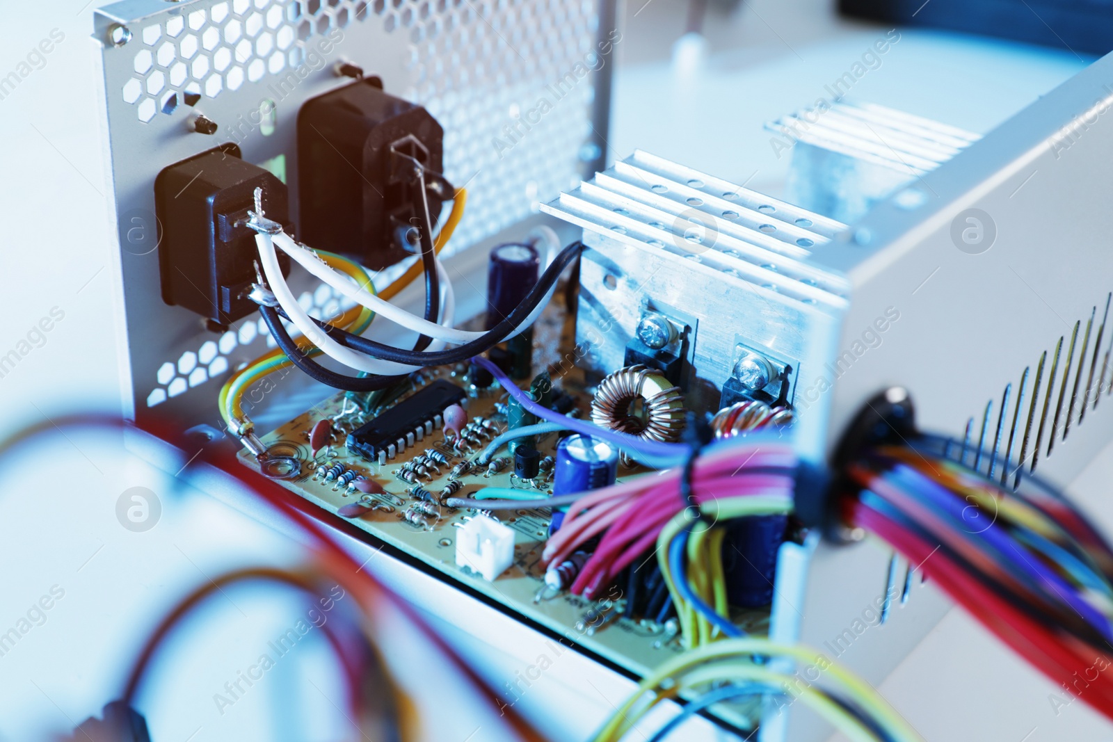 Photo of Power supply unit on table, closeup. Computer repair service