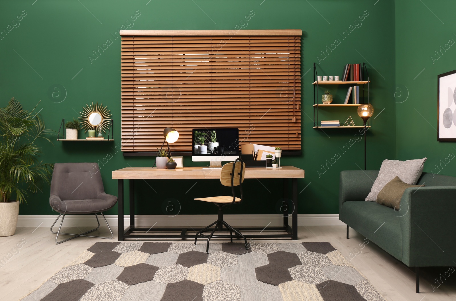 Photo of Comfortable workplace with modern computer near window in room. Interior design