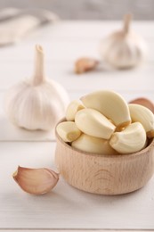 Fresh garlic on white wooden table, closeup