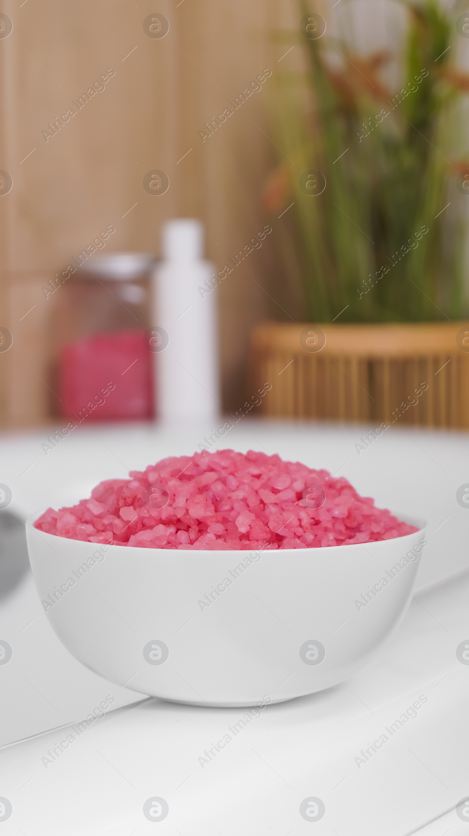 Photo of Bowl with sea salt on white bath