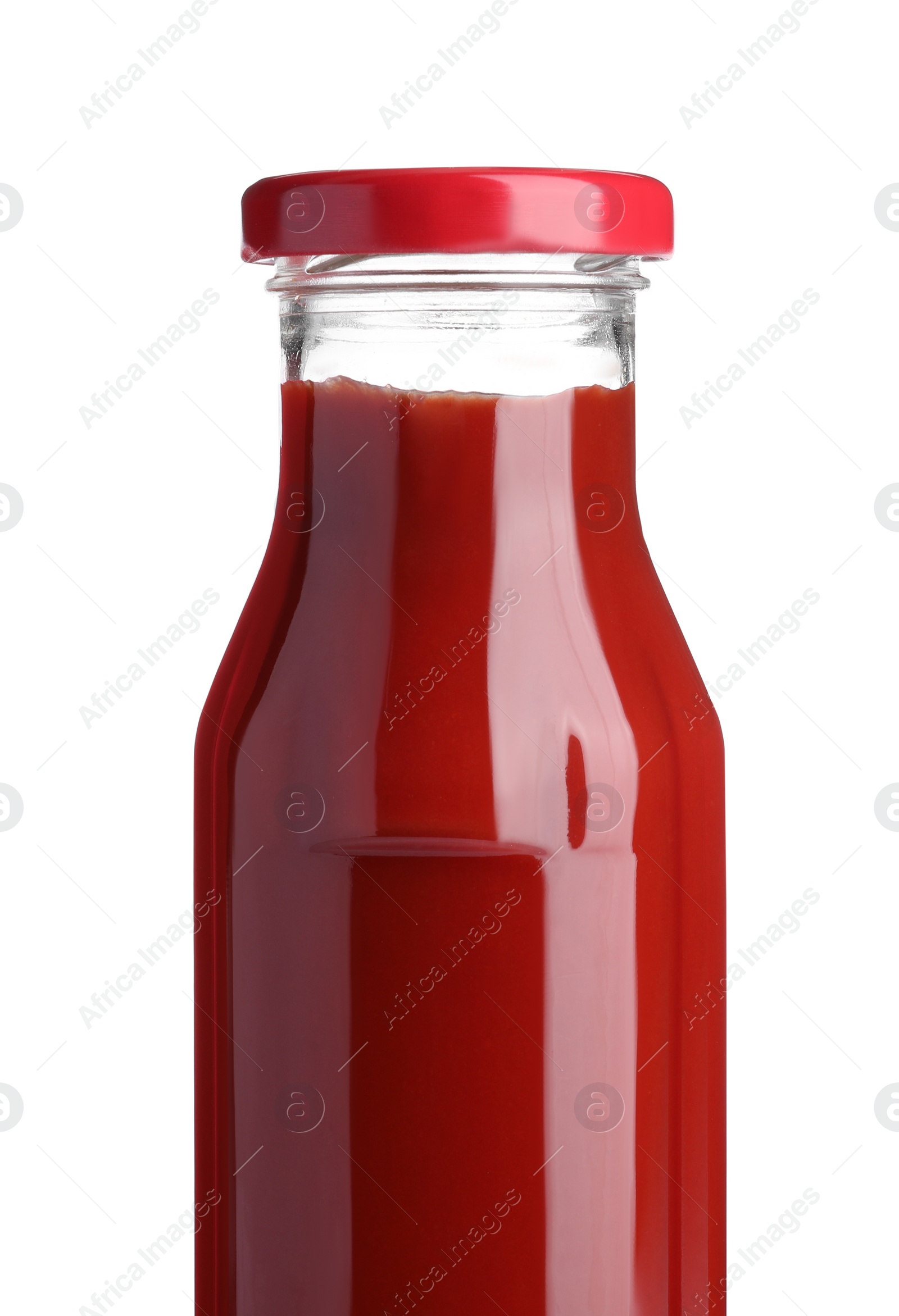 Photo of Glass bottle of tasty ketchup isolated on white