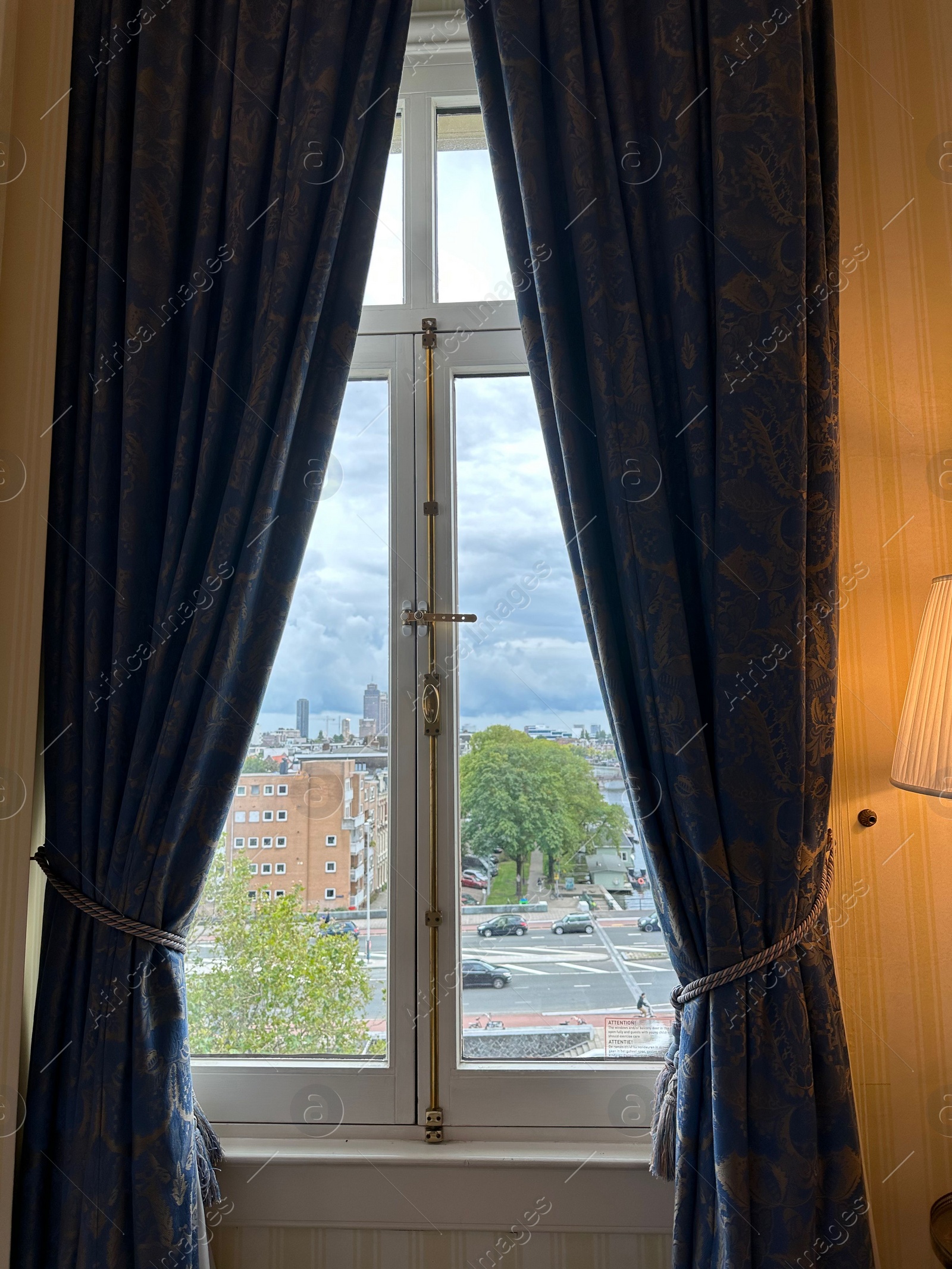 Photo of Amterdam, Netherlands - September 22, 2023: Beautiful view on city through Amstel Hotel window