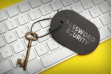 Image of Key with tag PASSWORD SECURITY on keyboard, closeup