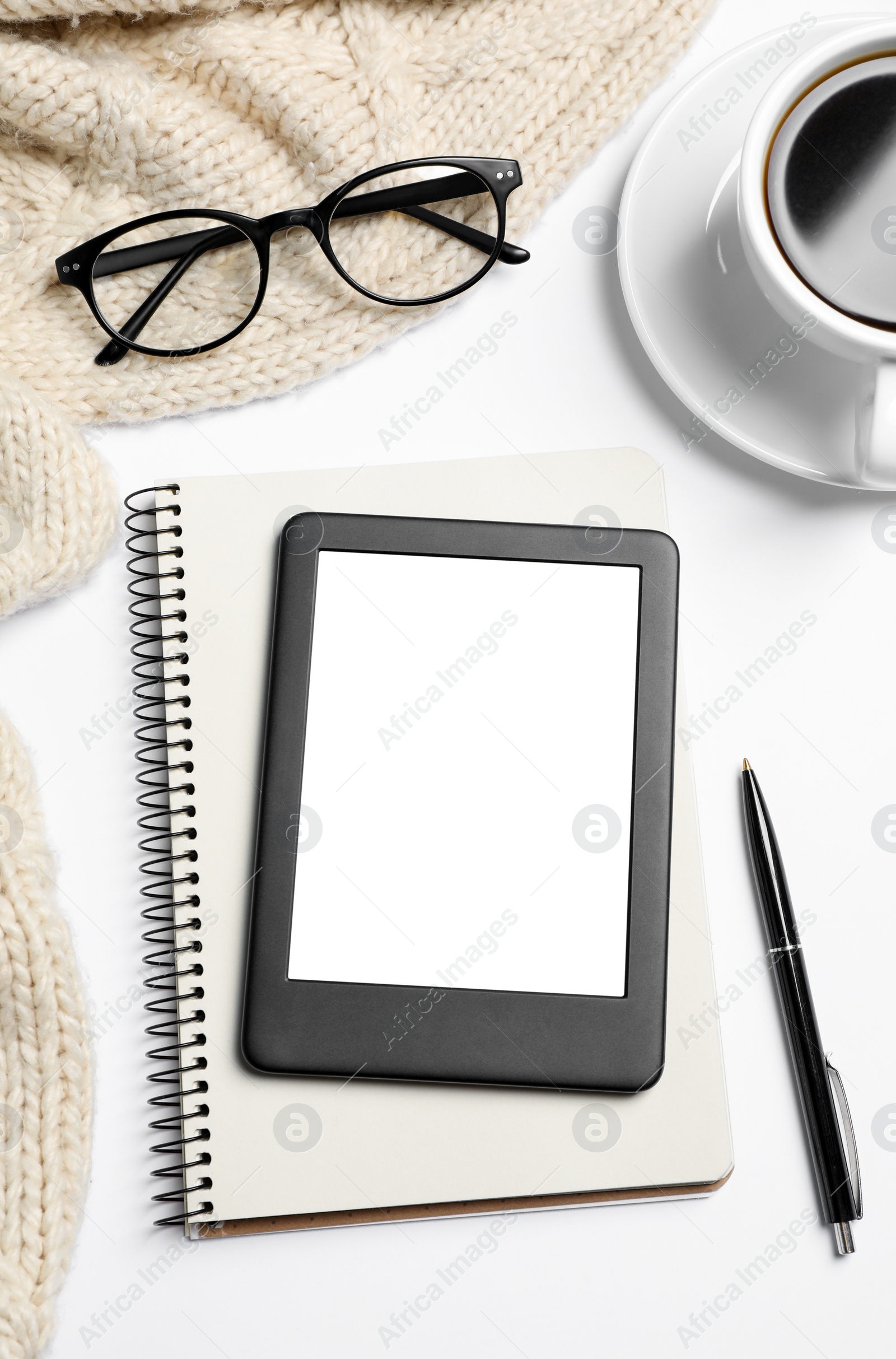 Photo of Flat lay composition with modern e-book reader on white table