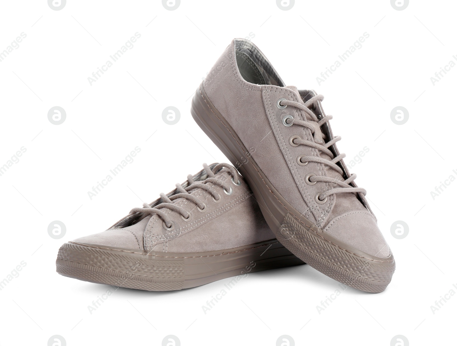 Photo of Pair of stylish sneakers on white background