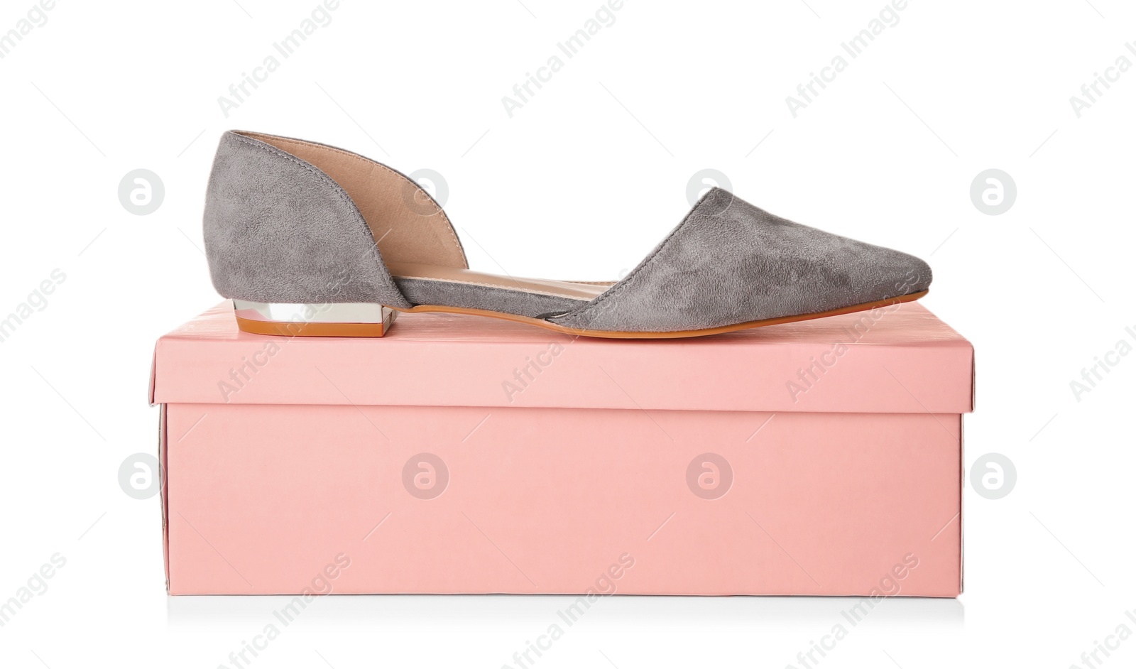 Photo of Female shoe and box on white background