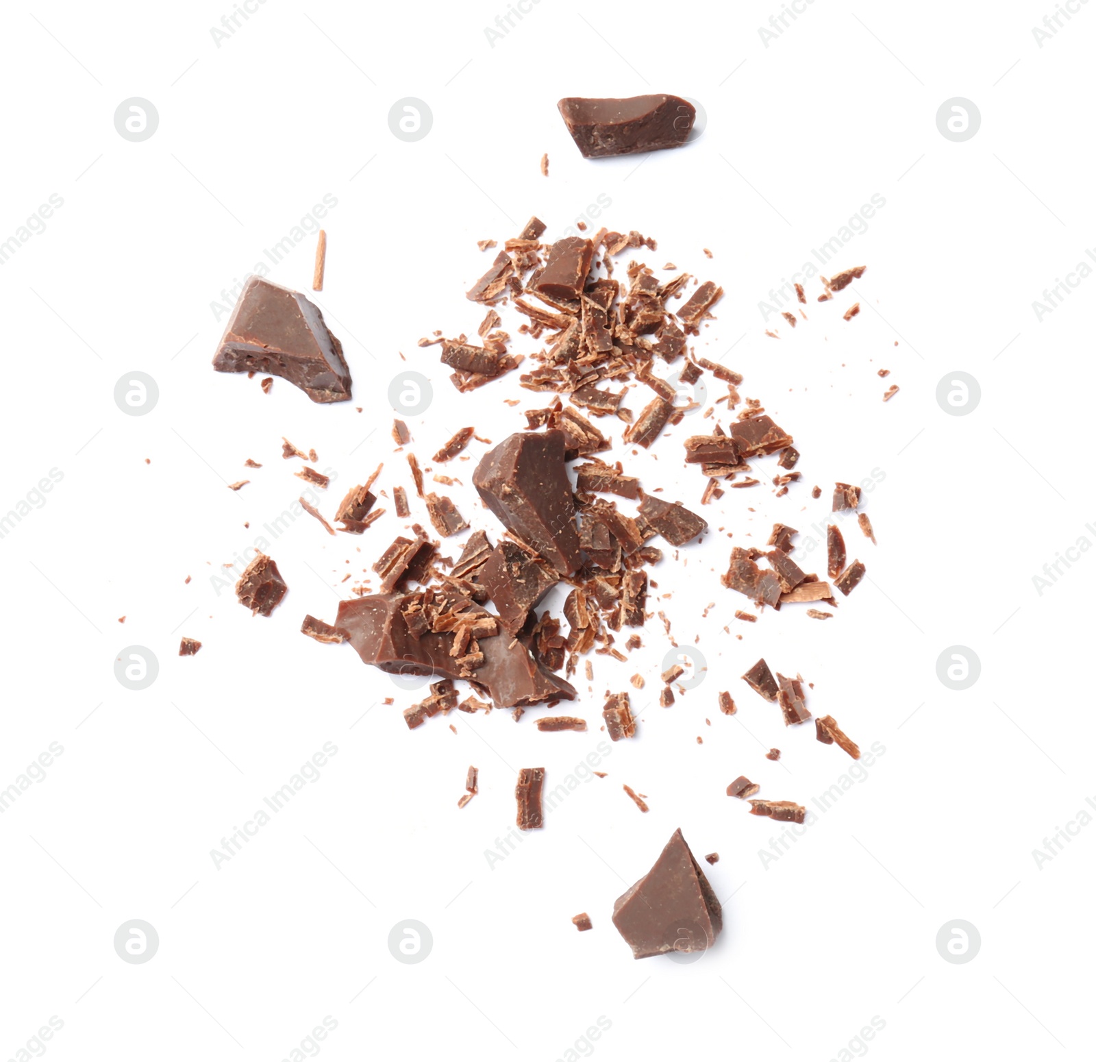 Photo of Delicious black chocolate shavings and pieces on white background, top view