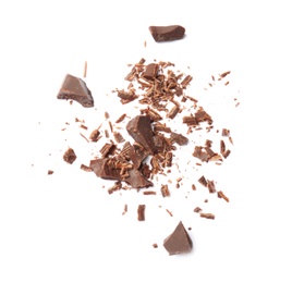 Delicious black chocolate shavings and pieces on white background, top view