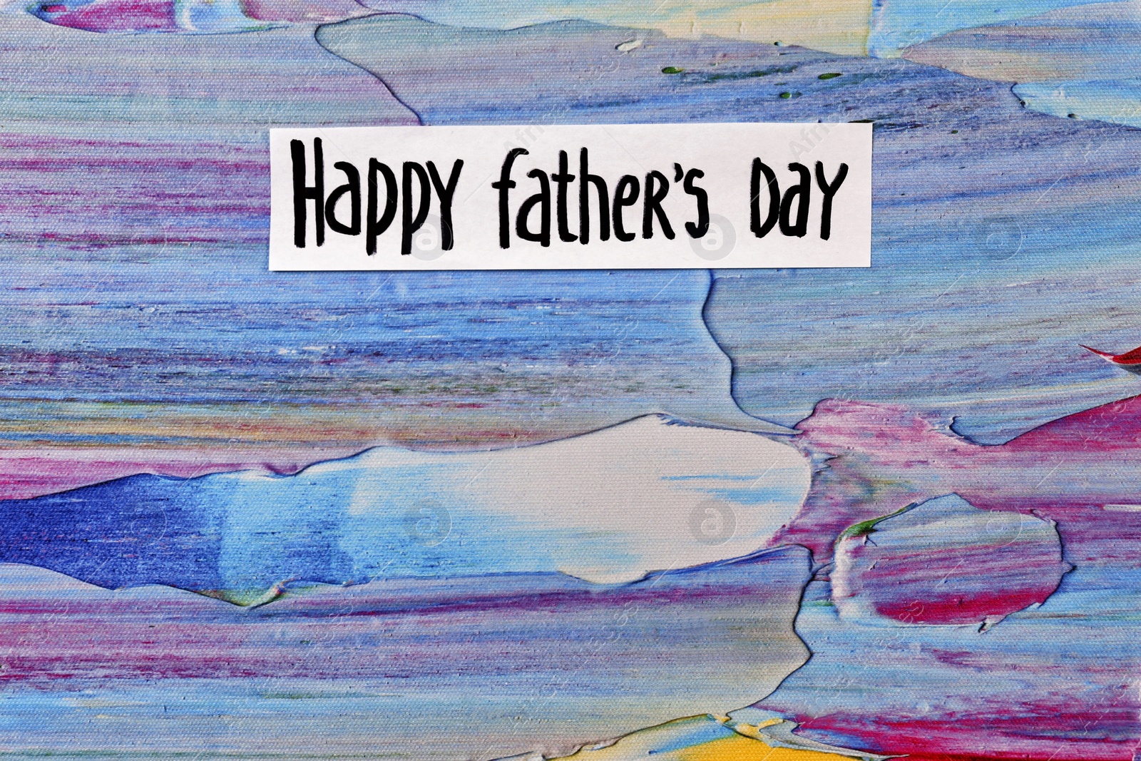 Photo of Phrase "Happy father's day" on color background