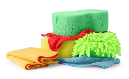 Photo of Sponges, cloths and car wash mitt on white background