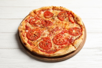 Hot cheese pizza Margherita on white wooden background