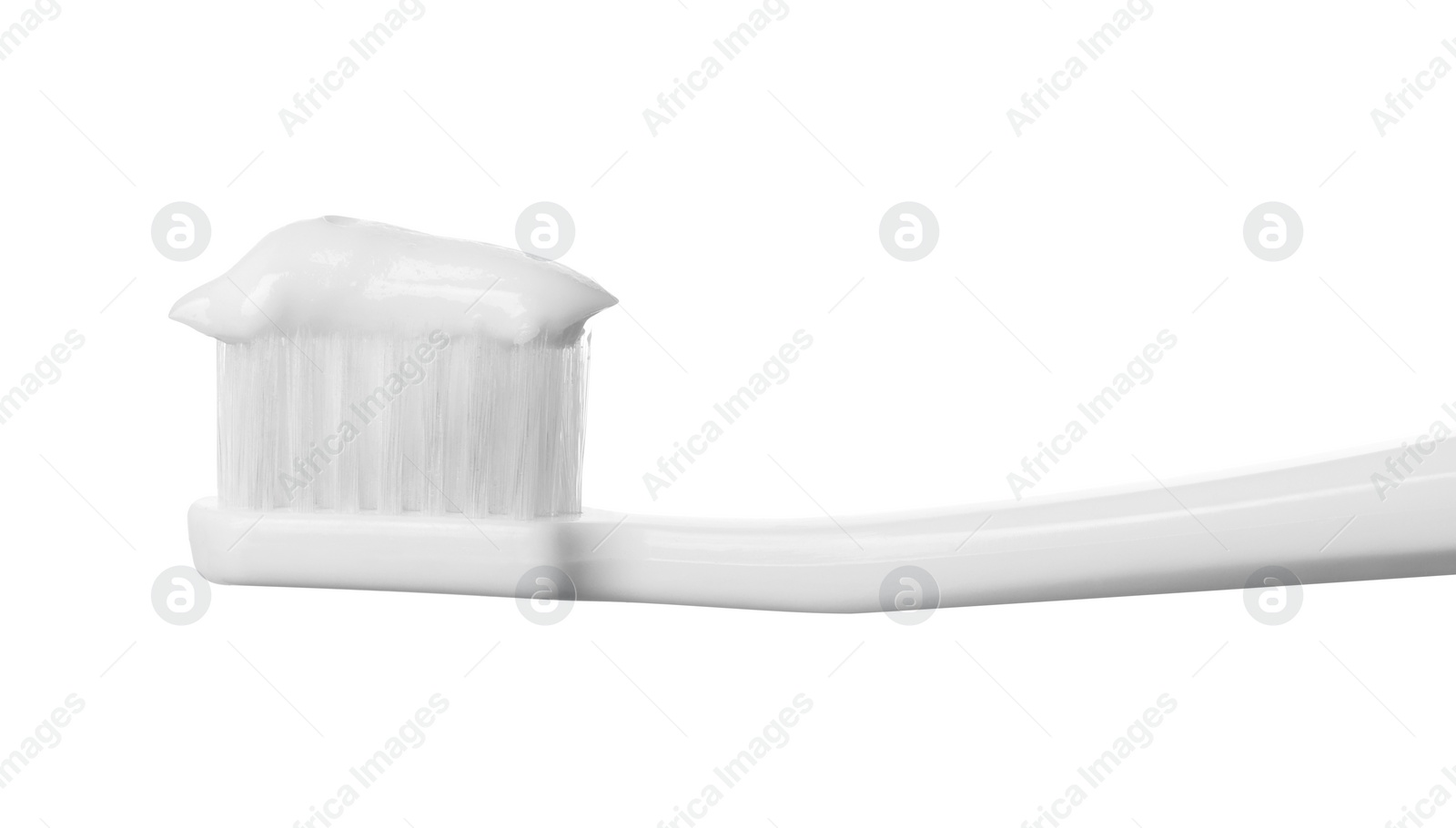 Photo of Plastic toothbrush with paste on white background, closeup