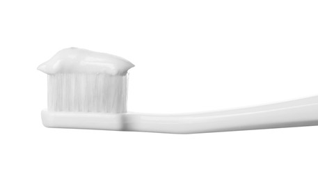 Plastic toothbrush with paste on white background, closeup
