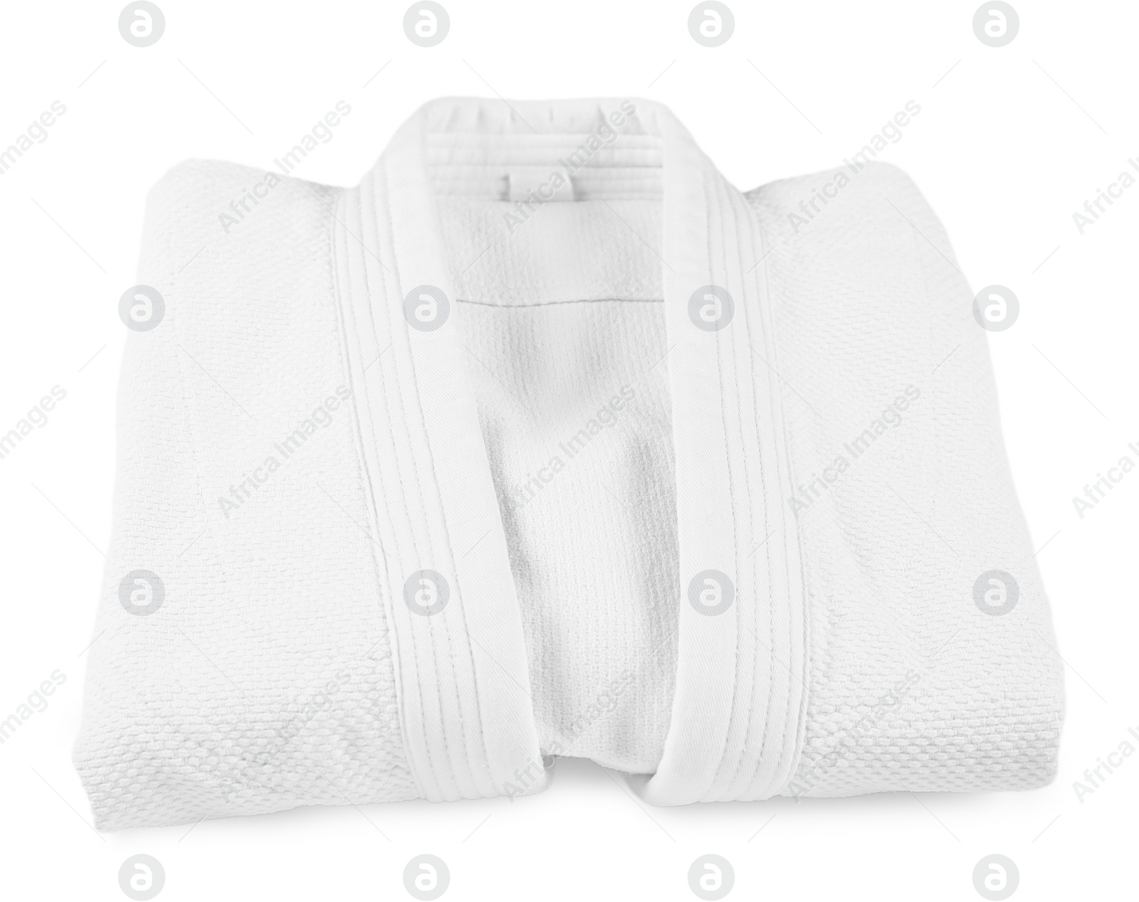 Photo of Folded kimono isolated on white. Martial arts uniform