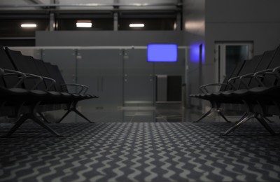 Photo of Waiting area with seats in airport terminal