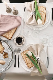 Photo of Festive Passover table setting, top view. Pesach celebration
