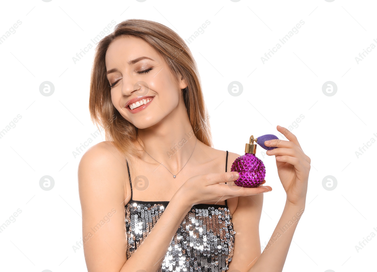 Photo of Young woman with bottle of perfume isolated on white