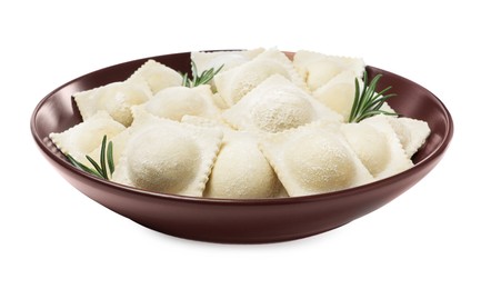 Uncooked ravioli and rosemary in bowl on white background