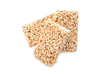 Photo of Delicious rice crispy treats isolated on white, top view