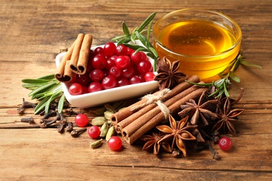 Photo of Composition with mulled wine ingredients on wooden table