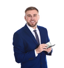 Portrait of young businessman holding money banknotes on white background