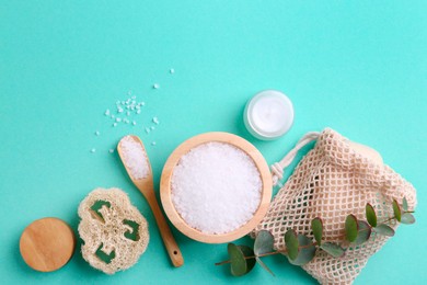 Photo of Jar of cream, body care products and eucalyptus branch on turquoise background, flat lay. Space for text