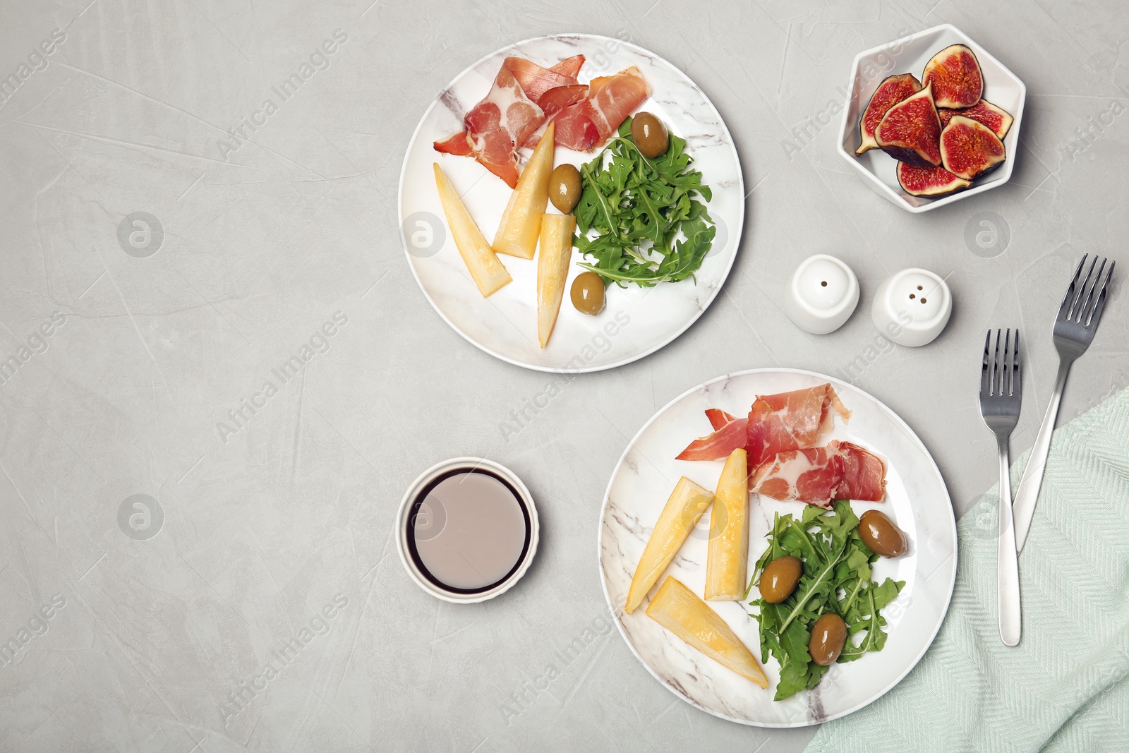 Photo of Flat lay composition with melon appetizer served on table. Space for text