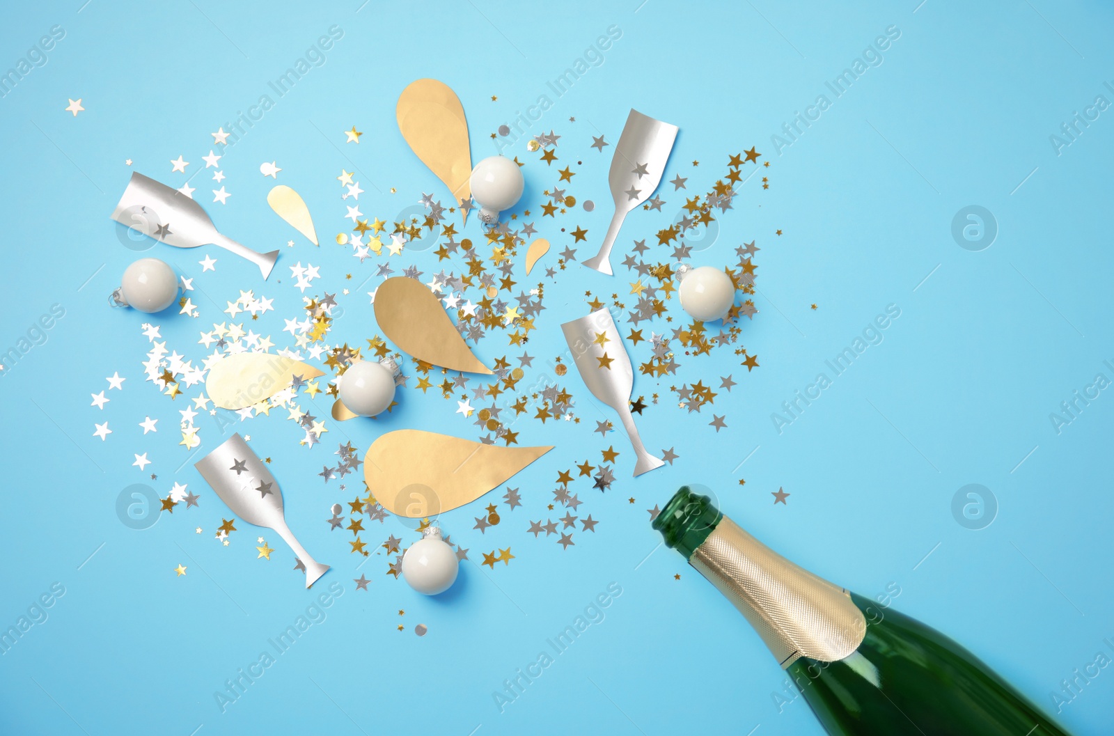 Photo of Creative flat lay composition with bottle of champagne on color background