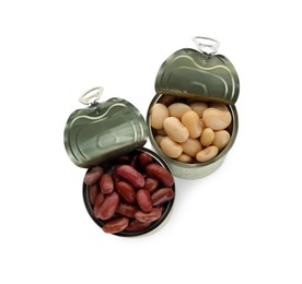 Tin cans with different canned kidney beans on white background, top view