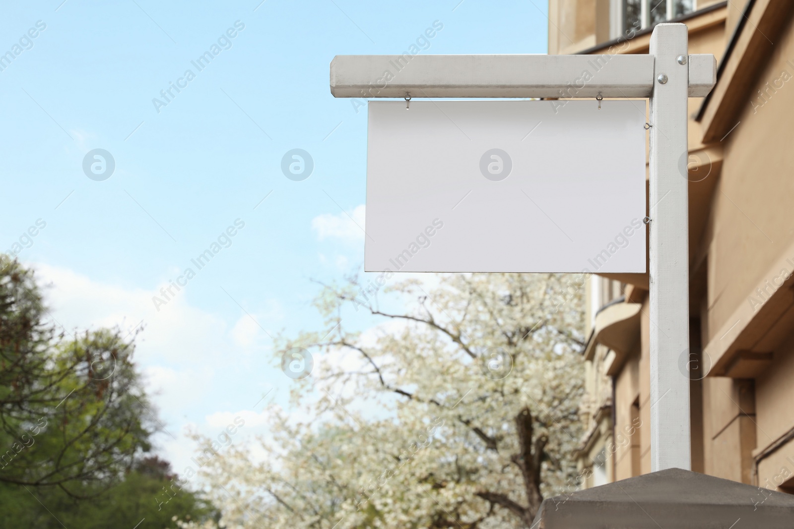 Photo of Blank advertising board on city street. Mockup for design